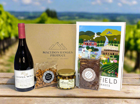 Gift set with a bottle of Lyon's Will Pinot Noir, snacks, and a card from the Macedon Ranges