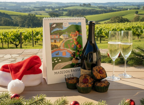 a bottle of Mt Towrong Prosecco an Elise Gow 2026 calendar and Christmas cake muffins
