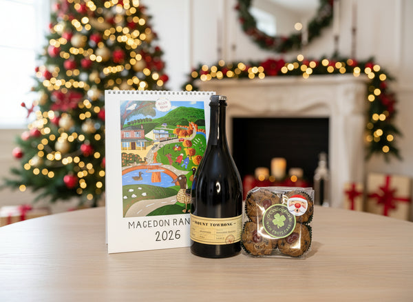 a bottle of Mt Towrong Prosecco an Elise Gow 2026 calendar and Christmas cake muffins