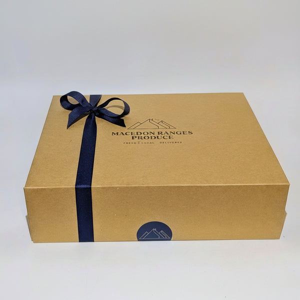 A Macedon Ranges Produce Gift Hamper Box with Ribbon.