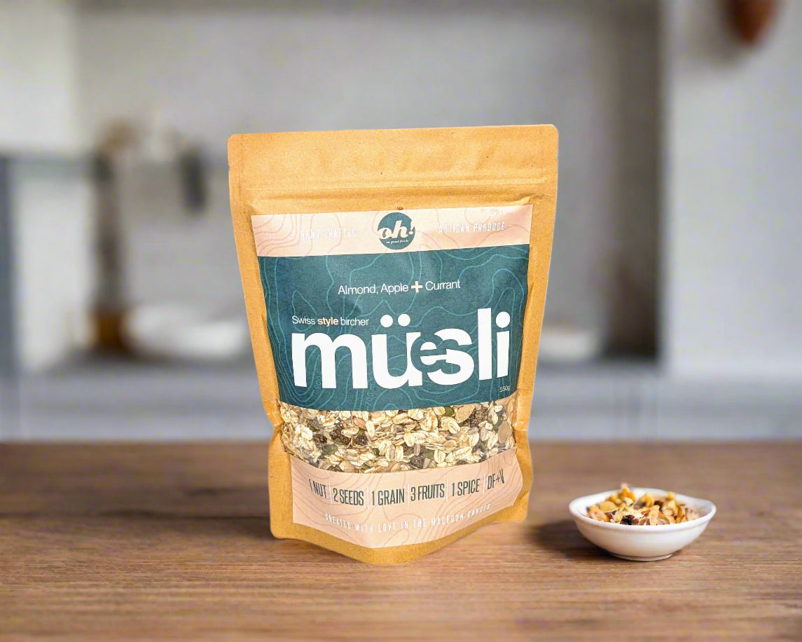 a bag of Swiss Bircher muesli made in the Macedon Ranges on the breakfast bench with nuts and fruit