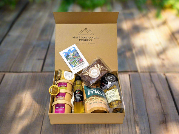 Gift box from Mcdon Ranges Produce with various products inside on a white background