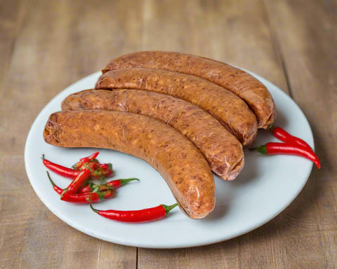 hot paprika sausages from Istra in the Macedon ranges on a plate with parsley 