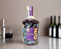 a bottle of pinot noir gin distilled in the Macedon Ranges on a bench with pinot noir bottles in background
