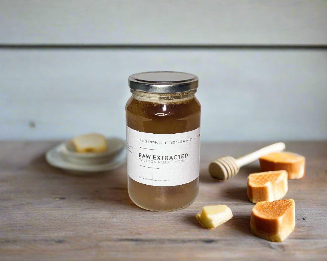 a jar of raw honey from the Macedon Ranges on a table with toast