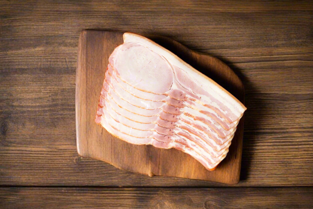 Bacon from the Macedon Ranges on a wooden chopping board ready for breakfast